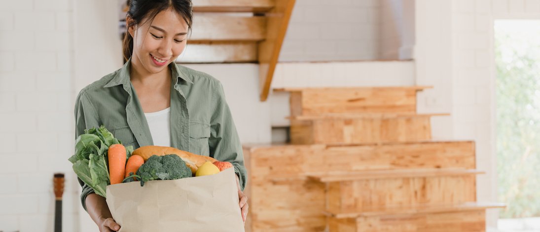 asian-women-holding-grocery-shopping-paper-bags-hom